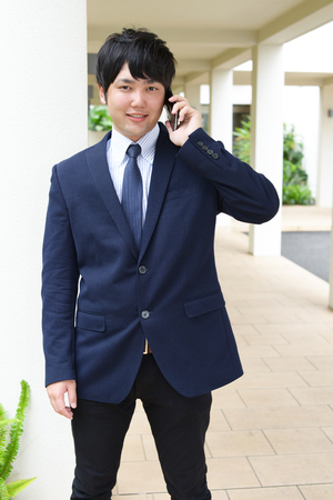 Businessman with a smart phoneの写真素材