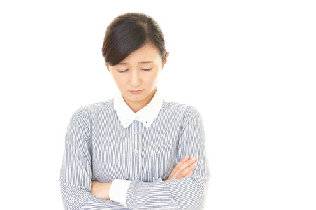 Disappointed Asian business womanの写真素材