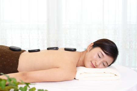 Woman relaxing at spa salonの写真素材