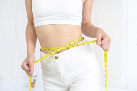 Woman who is measuring her waistの写真素材