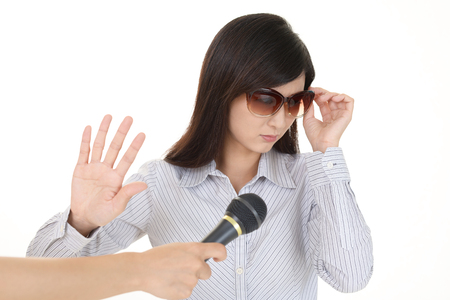 Young woman and paparazziの写真素材