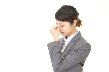 The woman with eyestrainの写真素材