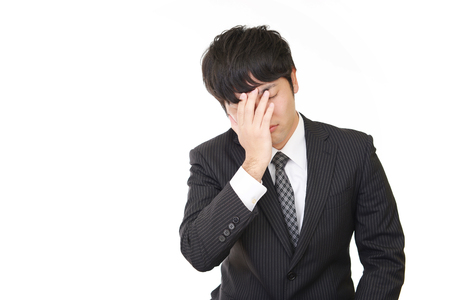 Disappointed Asian businessmanの写真素材