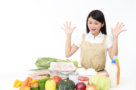 Woman smiling with vegetablesの写真素材