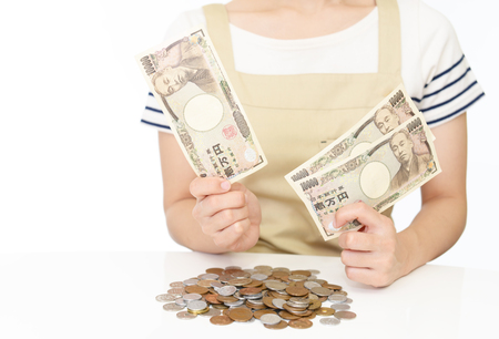 Housewife with moneyの写真素材