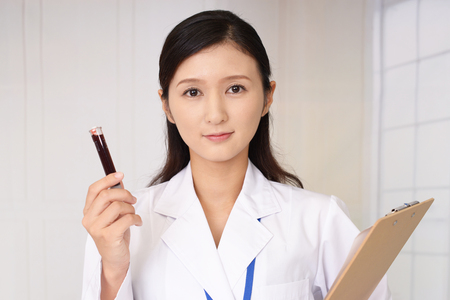 Doctor with blood sampleの写真素材