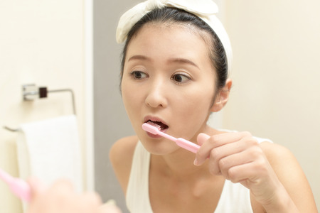 Woman brushing her teeth