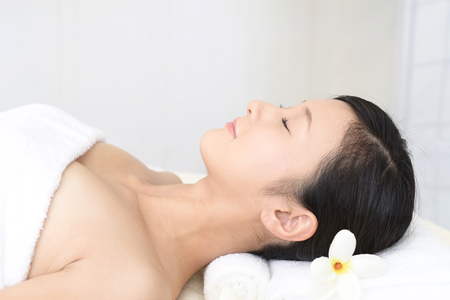 Woman relaxing at spa salonの写真素材