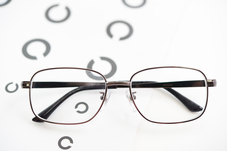 Glasses with Landolt ring chart