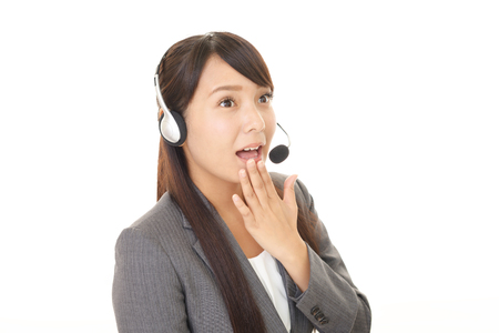 Surprised call center operatorの写真素材
