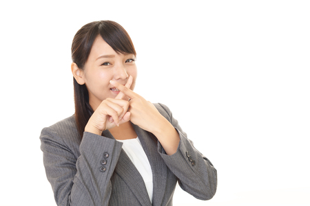 Businesswoman demonstrating prohibiting gestureの写真素材