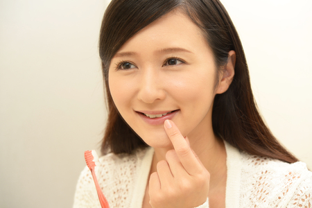 Woman with a toothbrushの写真素材