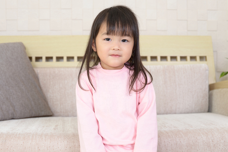 Cute little Asian girl smilingの写真素材