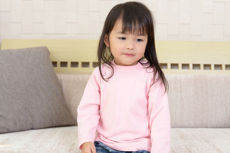 Cute little Asian girl smilingの写真素材