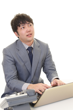 Tired Asian businessmanの写真素材