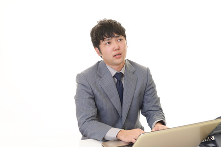 Tired Asian businessmanの写真素材