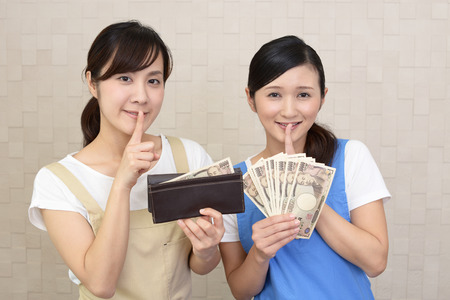 Women placing finger on lips.の写真素材