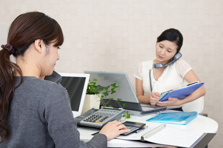 Working Asian business womenの写真素材