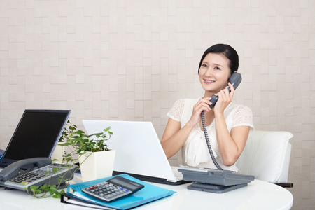 Business woman with a phoneの写真素材