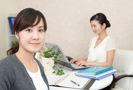 Smiling Asian business womenの写真素材