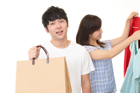 Young couple with shopping bagの写真素材