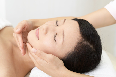 Woman getting a facial massageの写真素材