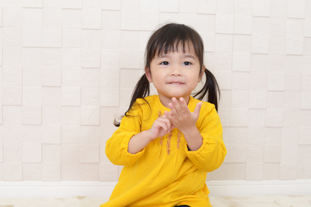 Cute little Asian girl smilingの写真素材