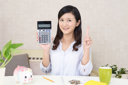 Woman with a calculatorの写真素材
