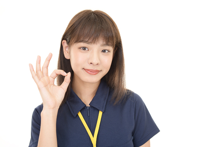 Woman with ok hand signの写真素材