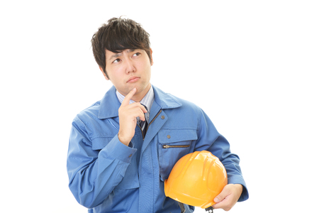 Uneasy Asian workerの写真素材