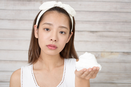 Woman washing her faceの写真素材