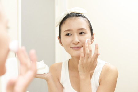 Woman washing her faceの写真素材
