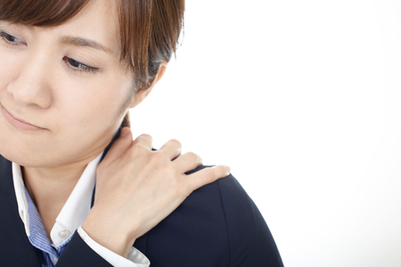 Business woman who has a shoulder pain.の写真素材