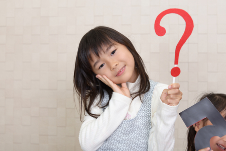 Asian girl with a question markの写真素材