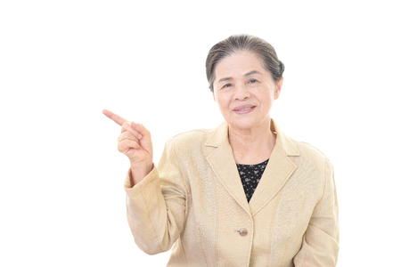 Old woman pointingの写真素材