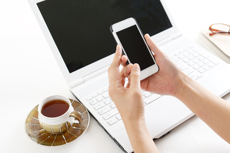 Hands operating  smart phoneの写真素材