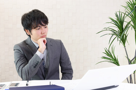 Portrait of businessman looking uneasyの写真素材