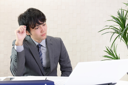 Portrait of businessman looking uneasyの写真素材