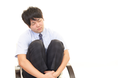 Depressed Asian businessmanの写真素材