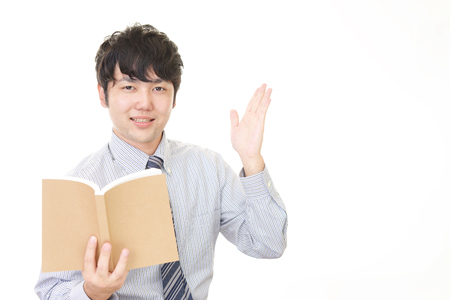 Smiling Asian teacherの写真素材