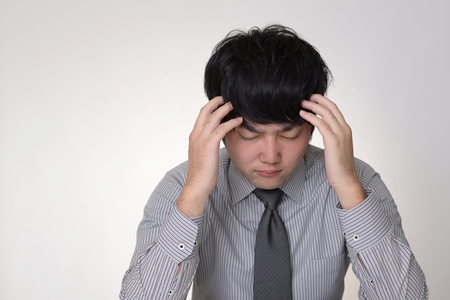 Frustrated Asian businessmanの写真素材