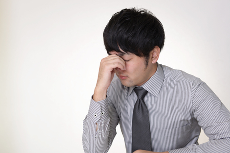 Disappointed Asian businessmanの写真素材