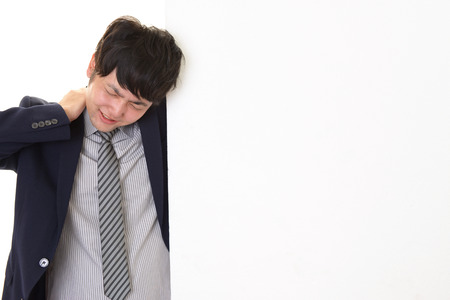 Tired and stressed Asian businessmanの写真素材