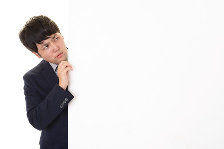 Uneasy Asian businessmanの写真素材