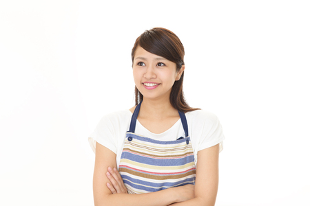 Smiling woman in apronの写真素材