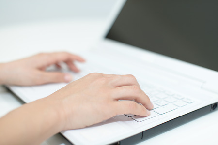 Woman using a laptopの写真素材