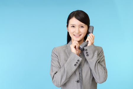 Business woman with a phoneの写真素材
