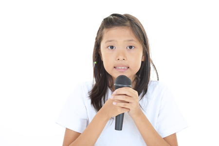 Asian girl singing karaokeの写真素材