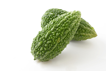 Fresh bitter gourds  isolated on whiteの写真素材