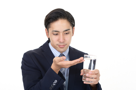 Man who drinks supplementsの写真素材
